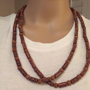 Handmade Brown wooden beads that are oval round